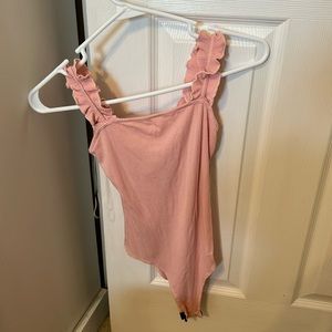 Pink body suit